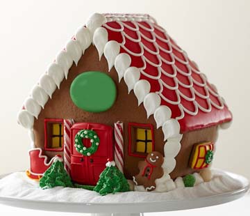Red-roof Christmas gingerbread house with candy detailing delivered for the holidays