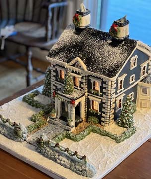 Designer model-home gingerbread showpiece with dark gingerbread panelling