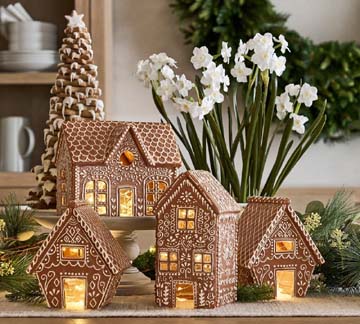 Designer cottage gingerbread house with intricate royal-icing roof and landscaping